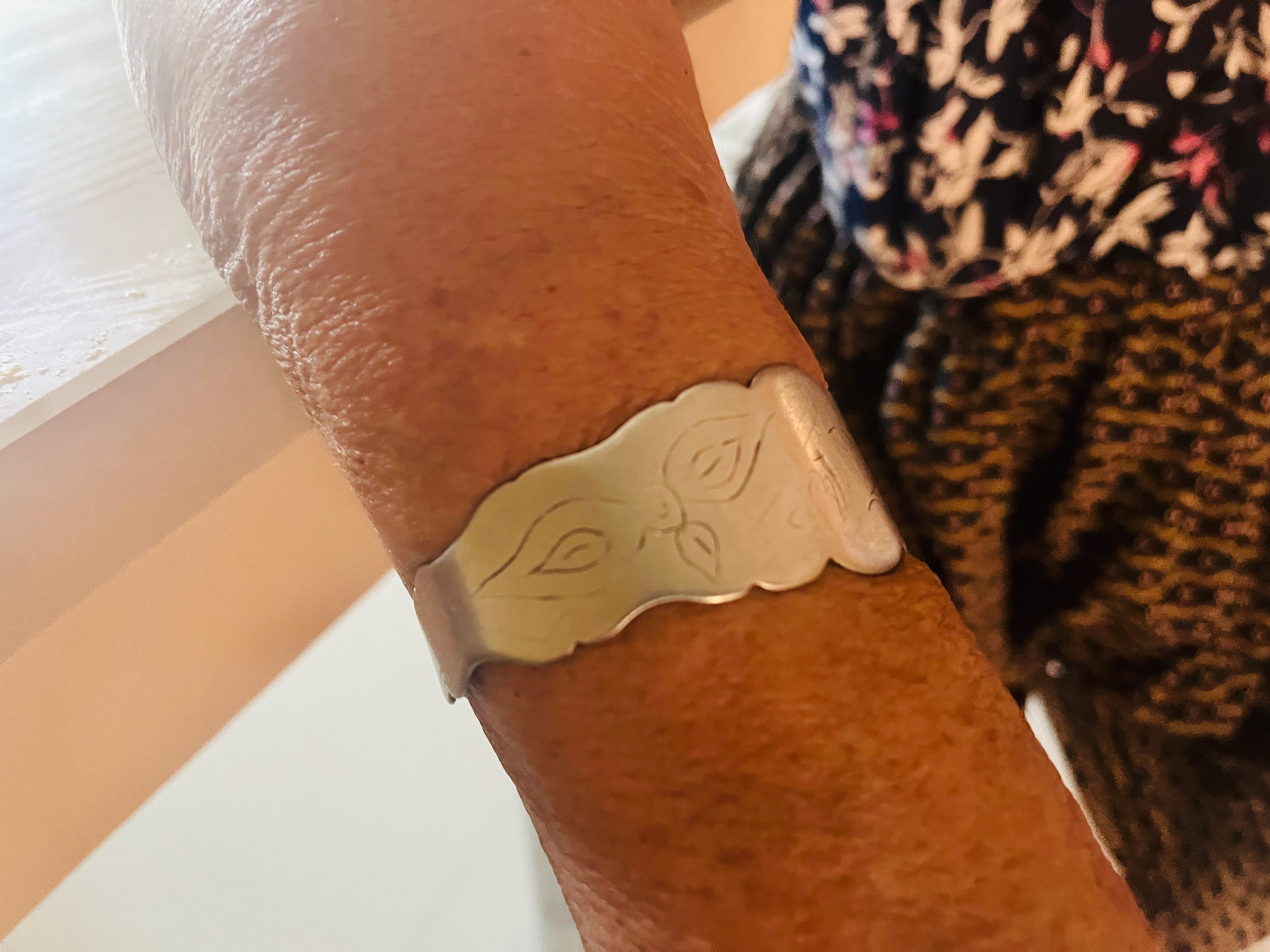 Silver bracelet with floral motif worn by a Turkish Tinsmith woman. Hârșova, Constanța County, July 2023
